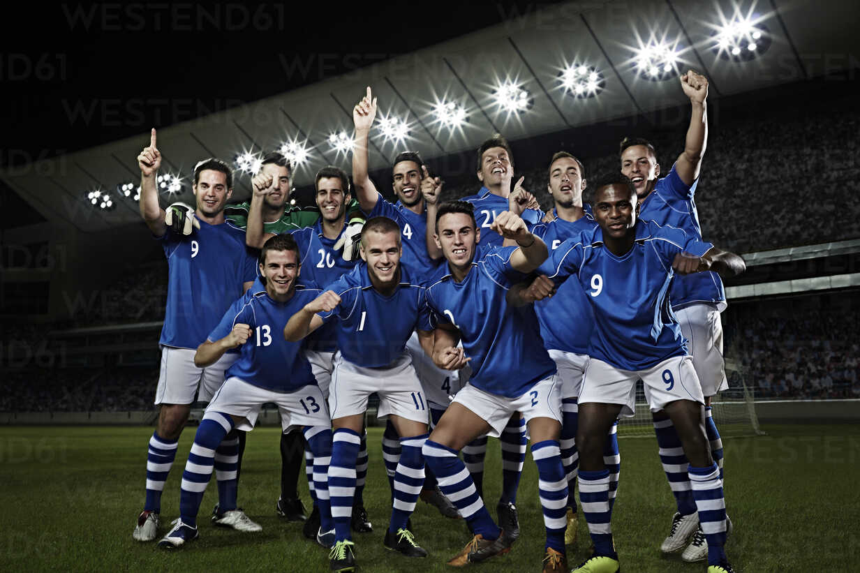 group of male soccer players in blue and white uniform